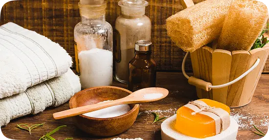 Natural sauna accessories including oils, honey, brushes and organic products